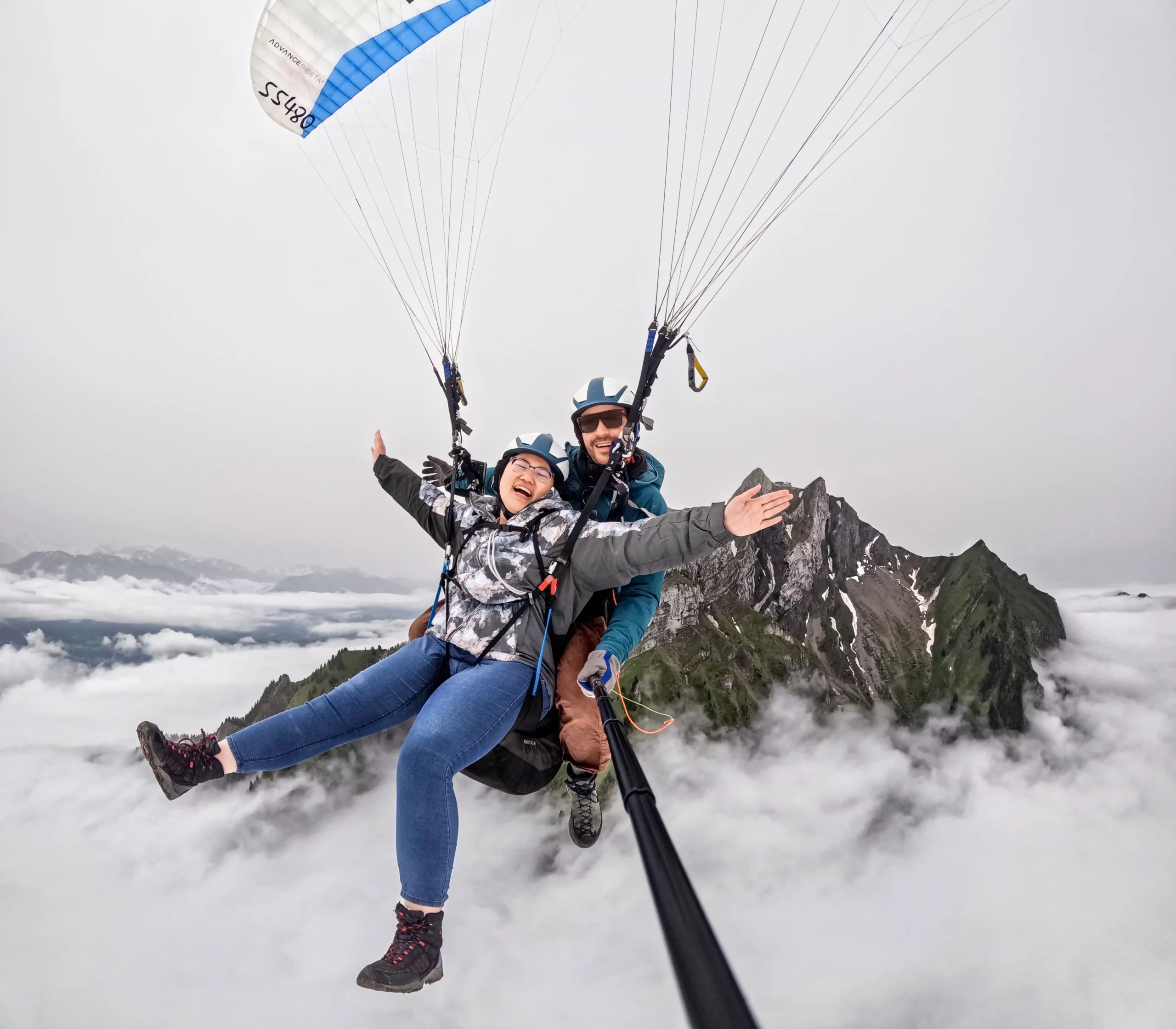 Tandem paragliding pilots preparing for take-off on Mount Pilatus